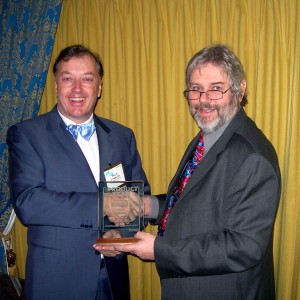 Photo of Philip O'Hanlon with John Atkinson, editor of Stereophile at CES 2007, receiving the "Amplifier of the Year" Award.