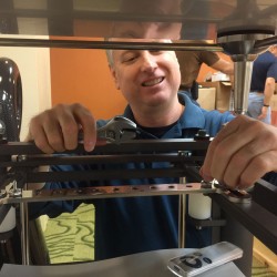 Scott Warren adjusting Artesania Audio's Exoteryc equipment rack at RMAF 2015